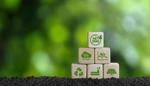 Stack of wooden blocks with green images of net-zero and other climate actions