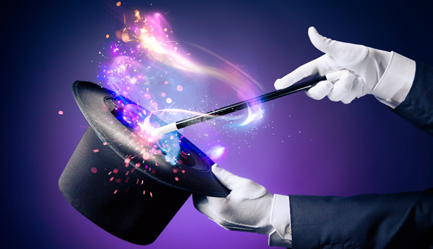 A magician working magic with a hat and wand