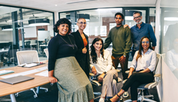 An ethnically diverse group of young professionals in an office