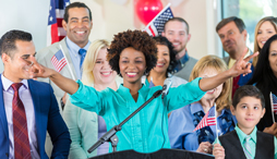 A woman celebrates winning her election with her supporters
