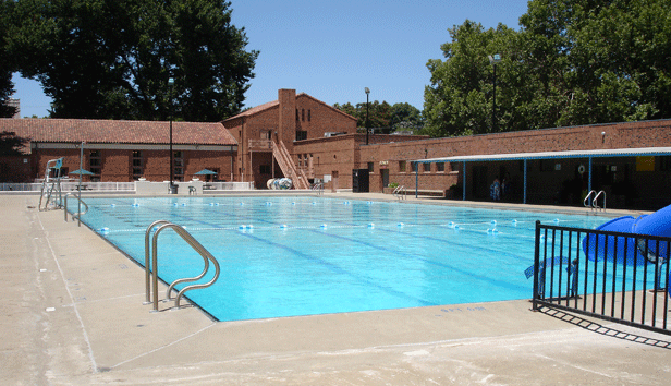 Empty outdoor public swimming pool waiting for swimmers