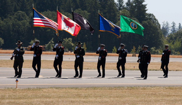 Military honor guard marching and presenting the U.S., Canadian, Washington, Oregon and MIA/POW flags
