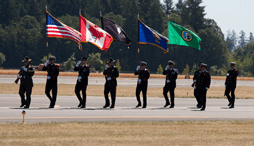 Military honor guard marching and presenting the U.S., Canadian, Washington, Oregon and MIA/POW flags